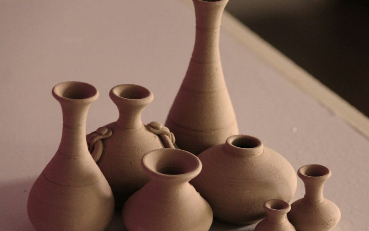 white clay vases on table
