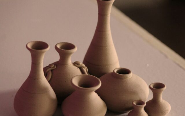 white clay vases on table