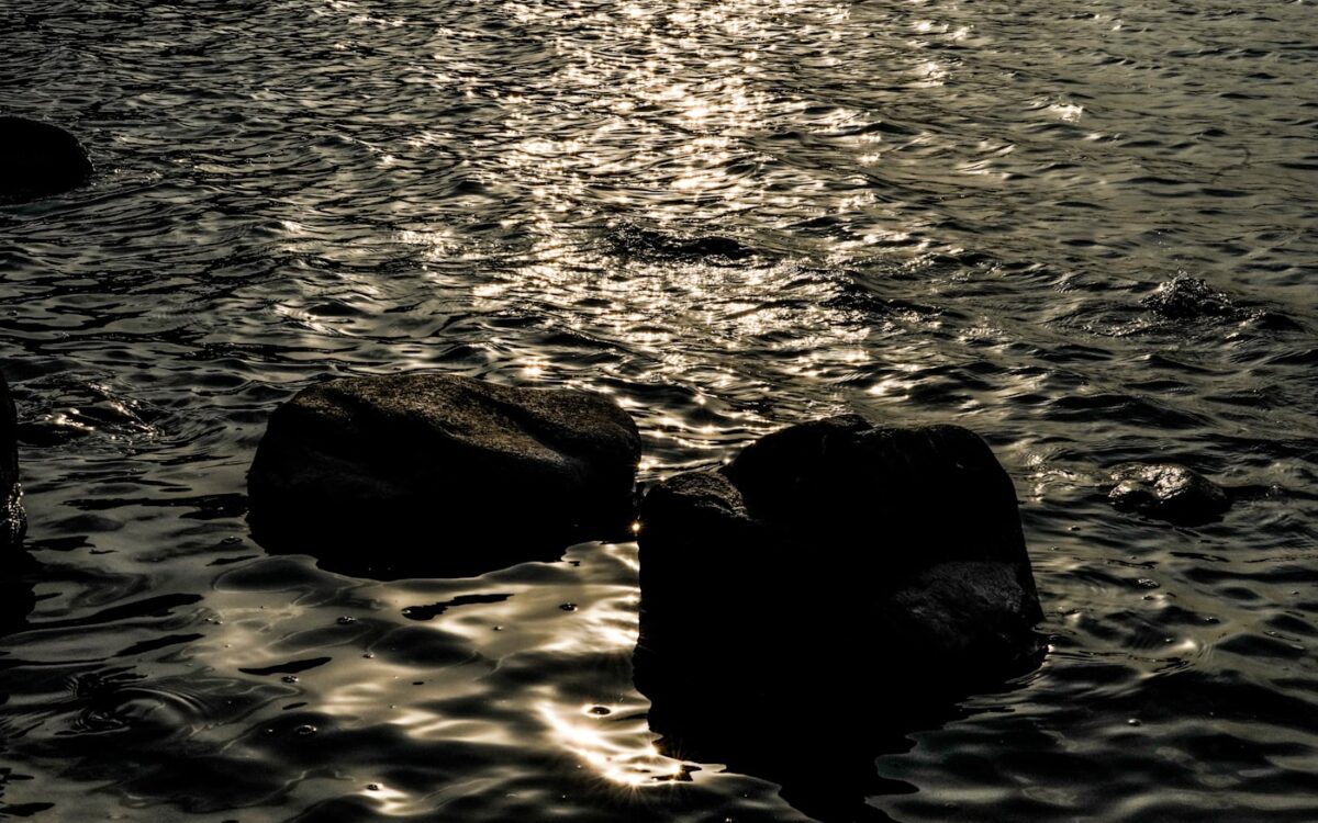 a body of water that has some rocks in it
