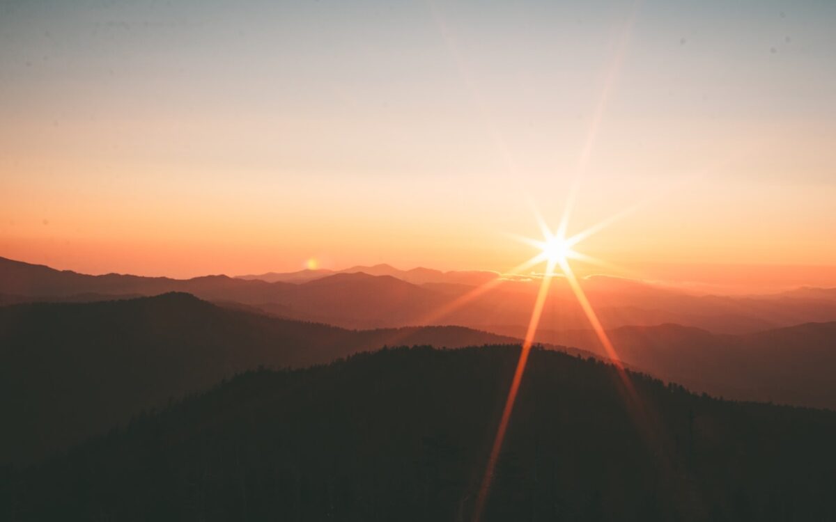 silhoutte of mountains during sunset