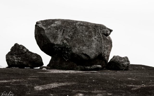 gray rock formation on brown sand during daytime