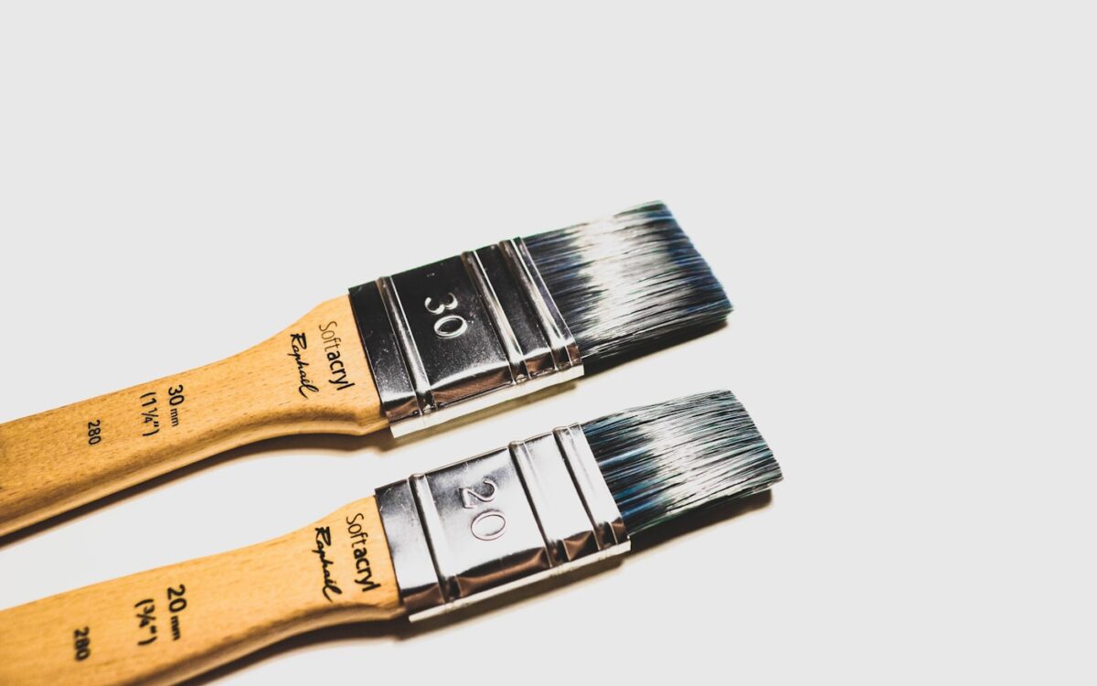 two brown paint brushes