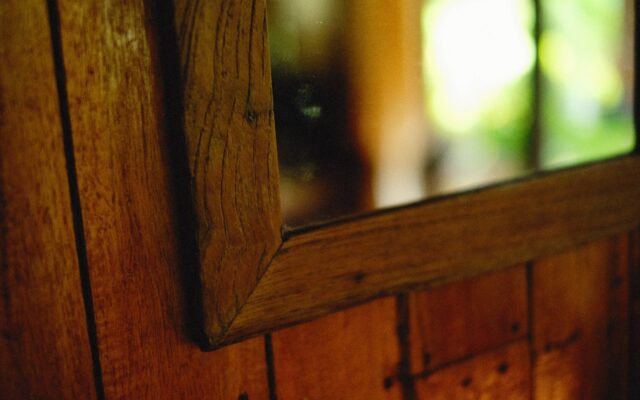 a wooden wall with a window