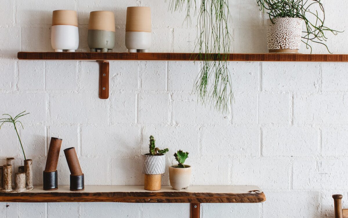 white ceramic mugs on brown wooden table