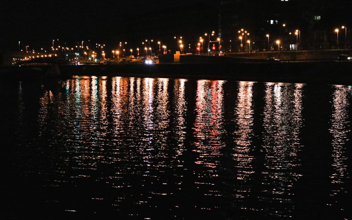 a body of water with lights on it