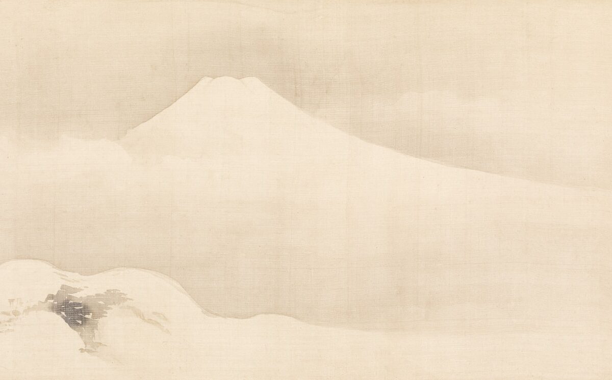 A majestic snow-capped mountain emerges from the clouds.