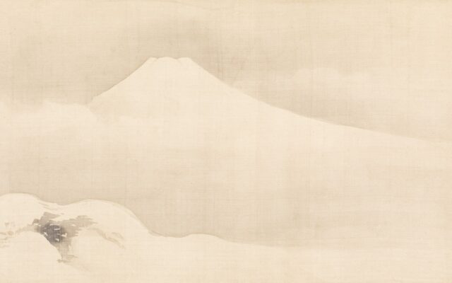 A majestic snow-capped mountain emerges from the clouds.