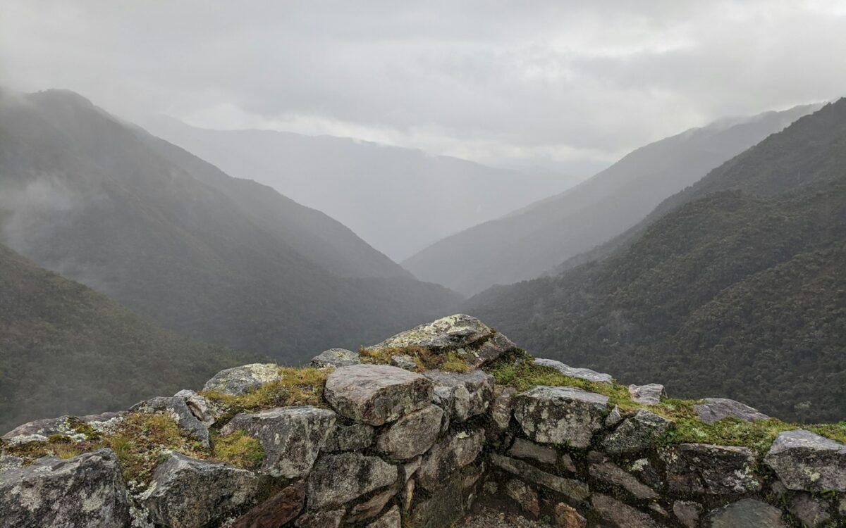 A stone wall in the middle of a mountain range