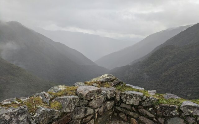 A stone wall in the middle of a mountain range