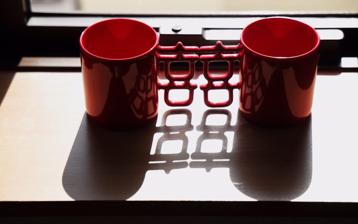 a couple of red cups sitting on top of a table