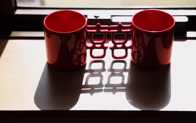 a couple of red cups sitting on top of a table