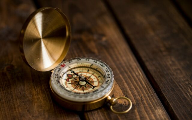 shallow focus photo of compass