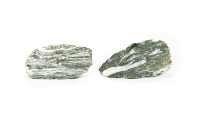 two green and white rocks on a white background