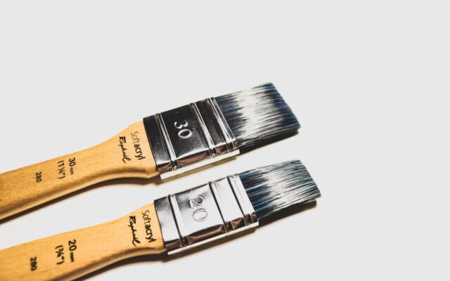 two brown paint brushes