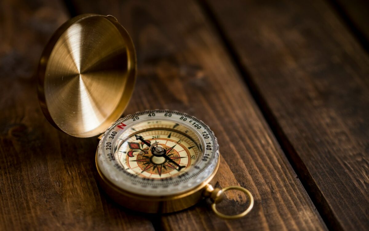 shallow focus photo of compass