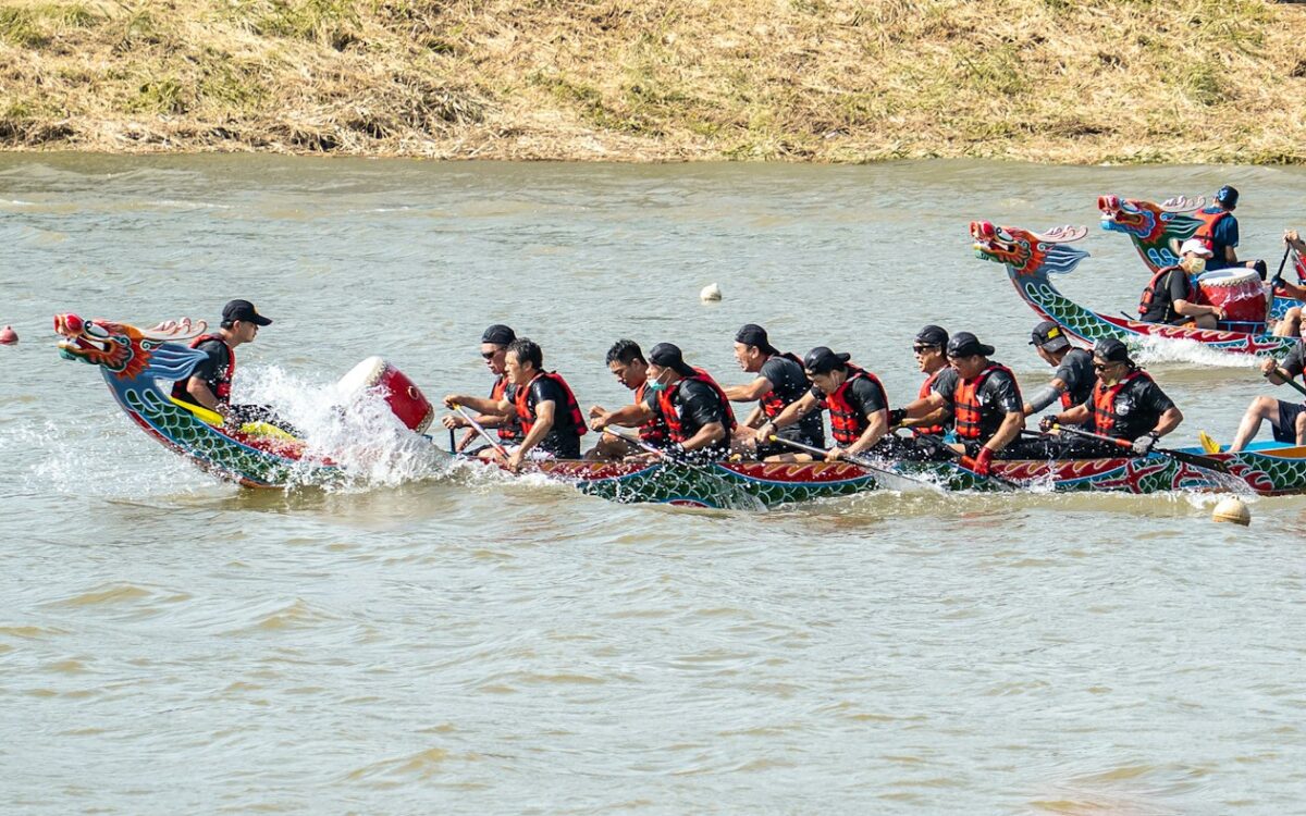 Dragon boat crew racing on a river