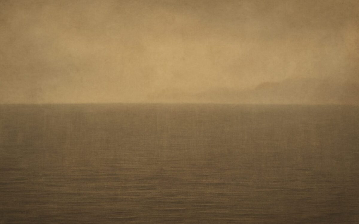 Calm grey sea beneath a misty horizon, evoking the Gui Hai day pillar in Ba Zi