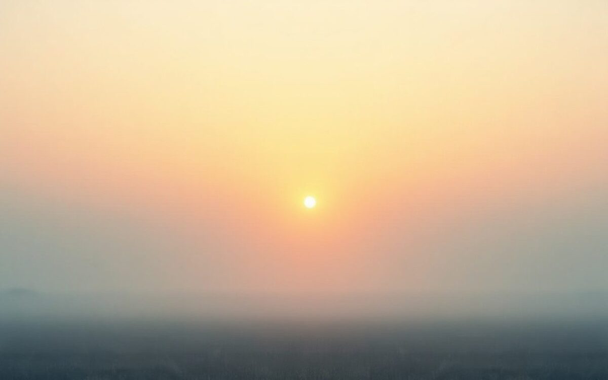 Morning sun rising over a wide misty plain, echoing Hexagram 35 Jin and steady progress