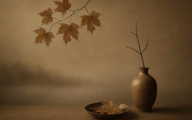 Maple leaves above a clay vase and dish in autumn mist, evoking Ren Water born in autumn in Ba Zi