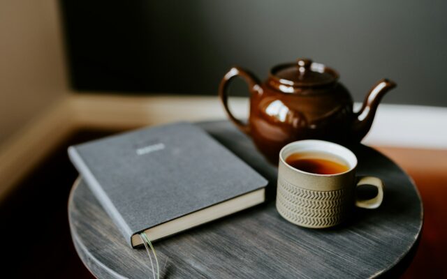 Teapot, cup and notebook set out for a chart reading session