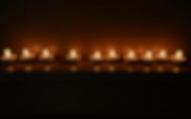 Ten tea lights flickering in a row, evoking the Ding Fire Day Master Ten Gods