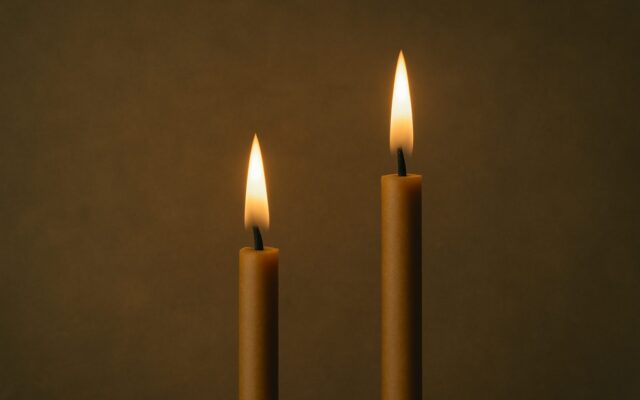 Two candle flames burning side by side, for Tiger and Snake compatibility